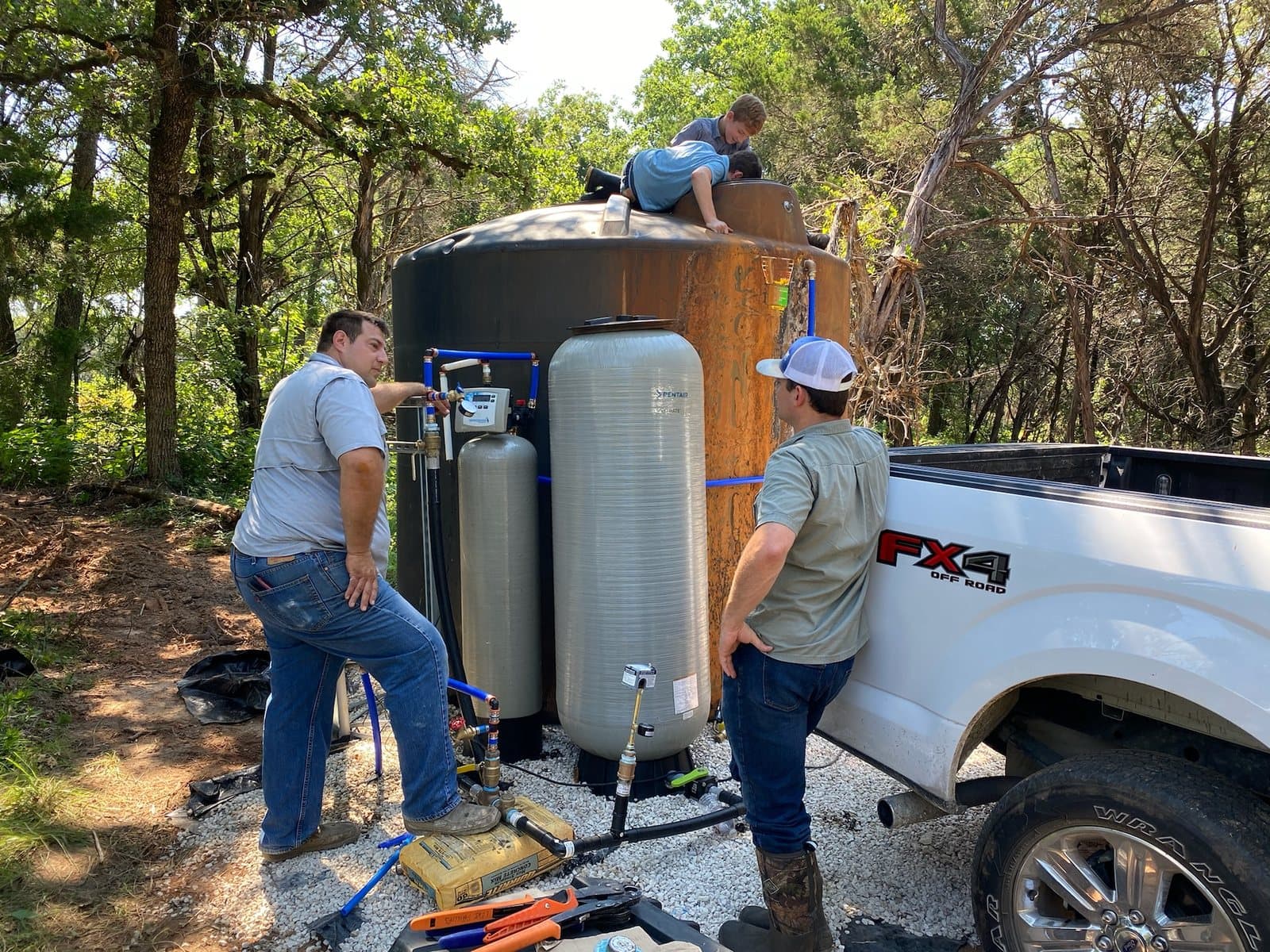 Streamline technicians installing water heater equipment